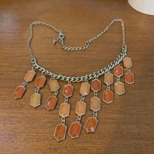 Gold toned statement necklace w/ orange/peach gems